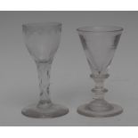 A George III Neo-Classical wine glass, ogee bowl engraved with swags, faceted stem,