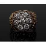 A diamond seven stone floral cluster ring, central round brilliant cut diamond approx 0.