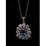 A sapphire and diamond floral pendant, central blue sapphire approx 0,75ct,