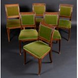 A set of six Empire style mahogany dining chairs, brass mounted swept rectangular backs,