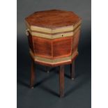 A George III brass bound mahogany octagonal cellaret, hinged cover, carrying handles to sides,