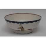 A Liverpool circular bowl, painted with two oriental figures, in polychrome, swaged blue border,