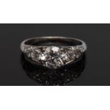 A diamond cluster ring, central round brilliant cut diamond approx 1.