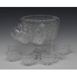 A 20th century hobnail and star cut punch bowl, label and eight mugs, 25cm high,
