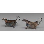 A pair of George III design silver sauce boats, acanthus capped flying-scroll handles,