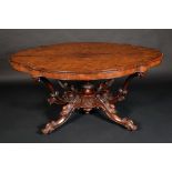 An early Victorian rosewood shaped oval centre table, well-figured top above a deep frieze,