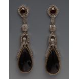 A pair of diamond white sapphire and red stone droplet earrings,