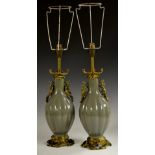 A pair of Chinese green celadon fluted ovoid vases, ormolu mounted as table lamps,