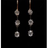 A pair of diamond three stone drop earrings,