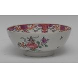 A Lowestoft bowl, decorated in the Famille Rose palette, with peonies and other foliage,