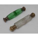 A 19th century green glass double-ended scent bottle, gilt brass covers, tapering faceted phial,