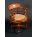 An Indian colonial hardwood swivel burgomeister desk chair,