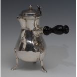 A Continental silver baluster chocolate pot, hinged cover with knop finial and scroll thumbpiece,