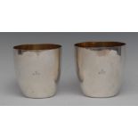 A graduated pair of George III stacking beakers, quite plain, gilt interiors, the largest 10cm diam,