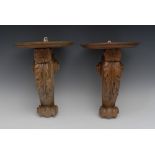 A pair of 19th century softwood wall brackets, boldly carved with shells, acanthus and scrolls,