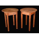A pair of late 20th century pine tables, circular tops above a deep frieze, square tapering legs,
