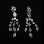 A pair of diamond encrusted triple drop earrings,