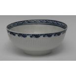 A Liverpool fluted bowl, moulded in relief with scrolling foliage, cobalt blue floral border,