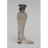 A Victorian novelty cut glass and silver-coloured scent bottle, as a tall boot,