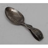 A George V silver novelty caddy or child's spoon, embossed with scenes from the story of Peter Pan,