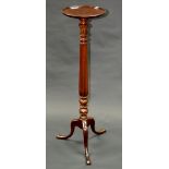 A George III Revival mahogany tripod torchere, dished circular top, fluted columns, tripod base,