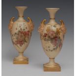 A pair of Royal Worcester two handled pedestal ovoid vase,