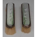 A pair of George V silver and enamel clothes brushes,