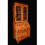 A George I walnut bureau bookcase,