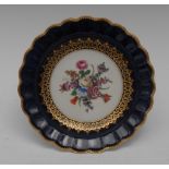 A Royal Worcester shaped circular plate, painted by E Phillips, signed,