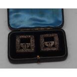 A pair of Victorian silver shoe buckles, cast and chased with foliate scrolls, bowed prong and bar,
