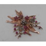 An early Victorian rose gold, diamond, ruby and pearl floral spray brooch,