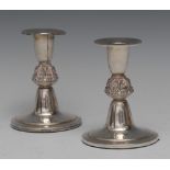 A pair of Irish silver candlesticks, slender bell shaped sconces with broad rims,