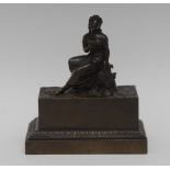 A Regency dark patinated bronze rectangular concealed inkwell,