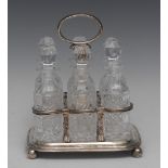 A George IV silver six-bottle condiment frame, posted loop handle, ball feet,