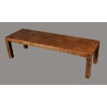 A late 20th century black and gold low sitting-room table, rectangular top, square legs, 38cm high,