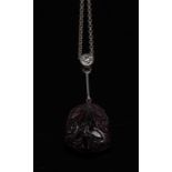 A pink tourmaline and diamond pendant necklace,