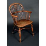 A 19th century yew and elm Windsor elbow chair, low hooped back with shaped and pierced splats,