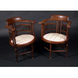 A pair of late Victorian mahogany and marquetry armchairs,