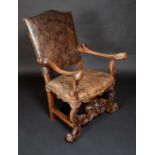 An 18th century Italian walnut armchair, broad rectangular back with serpentine cresting,