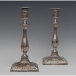 A pair of George III silver table candlesticks, detachable nozzles, bell shaped sconces,
