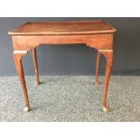 A George III mahogany rounded rectangular silver table, dished top with shallow gallery,