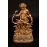 A Victorian cast iron umbrella stand, cast as a scantily clad boy grasping a snake, 84cm high,