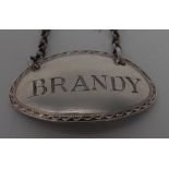 A George III silver oval wine label, Brandy, bright-cut engraved border, 4.