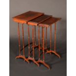 A nest of three post-Regency rosewood occasional tables, rectangular tops with shallow moulding,