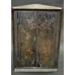 A George II black lacquered splay fronted corner cabinet, the doors with blossoming prunus,