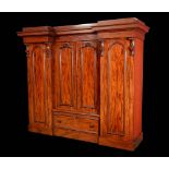 A large Victorian mahogany inverted breakcentre wardrobe,