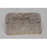 A Victorian silver rounded rectangular snuff box, embossed in the Dutch taste with musicians,