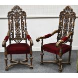 A pair of Victorian oak Gothic revival open arm chairs,