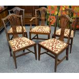 A set of five Chippendale Revival mahogany dining chairs