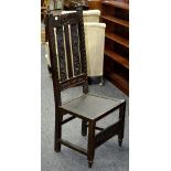 A late 19th century carved oak hall chair